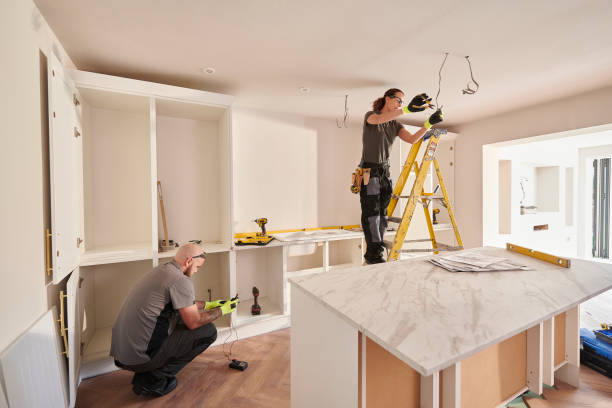 female electrician working in a kitchen remodelling Lighting Upgrades<br />